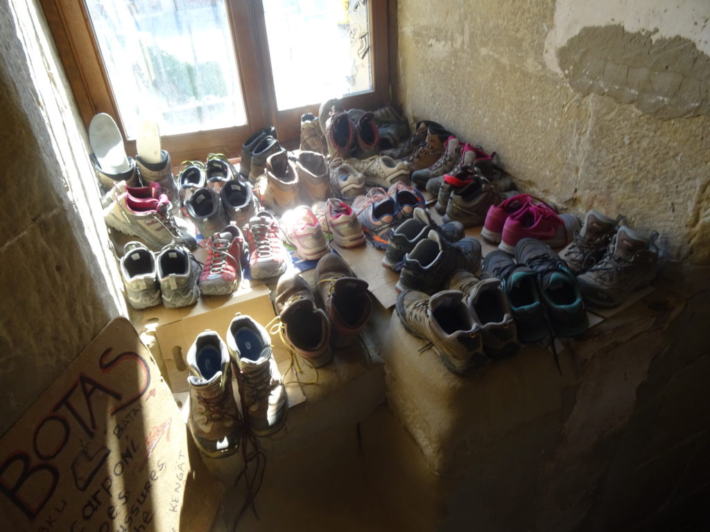 Camino pilgrims take their shoes off for the day